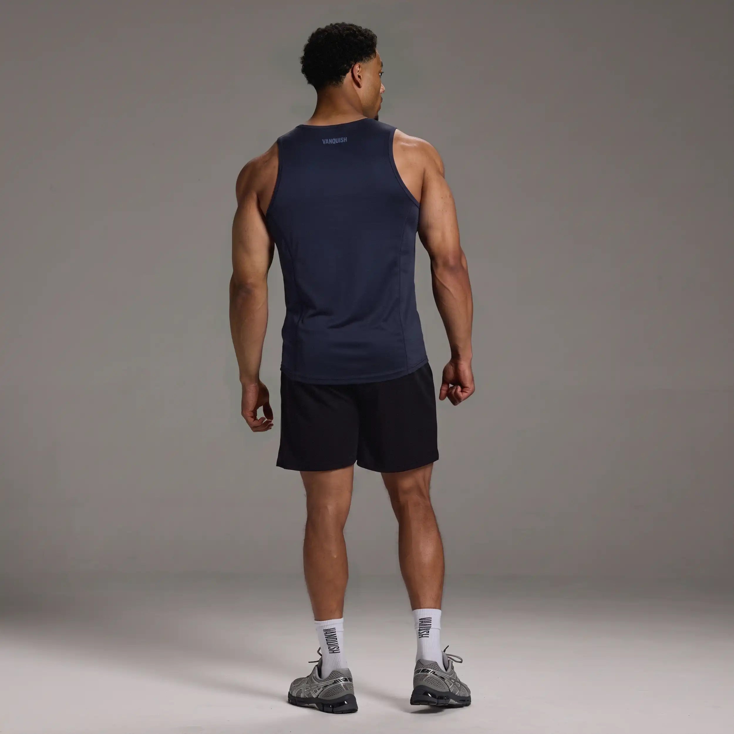 EVOLVE NAVY SLIM FIT PERFORMANCE TANK