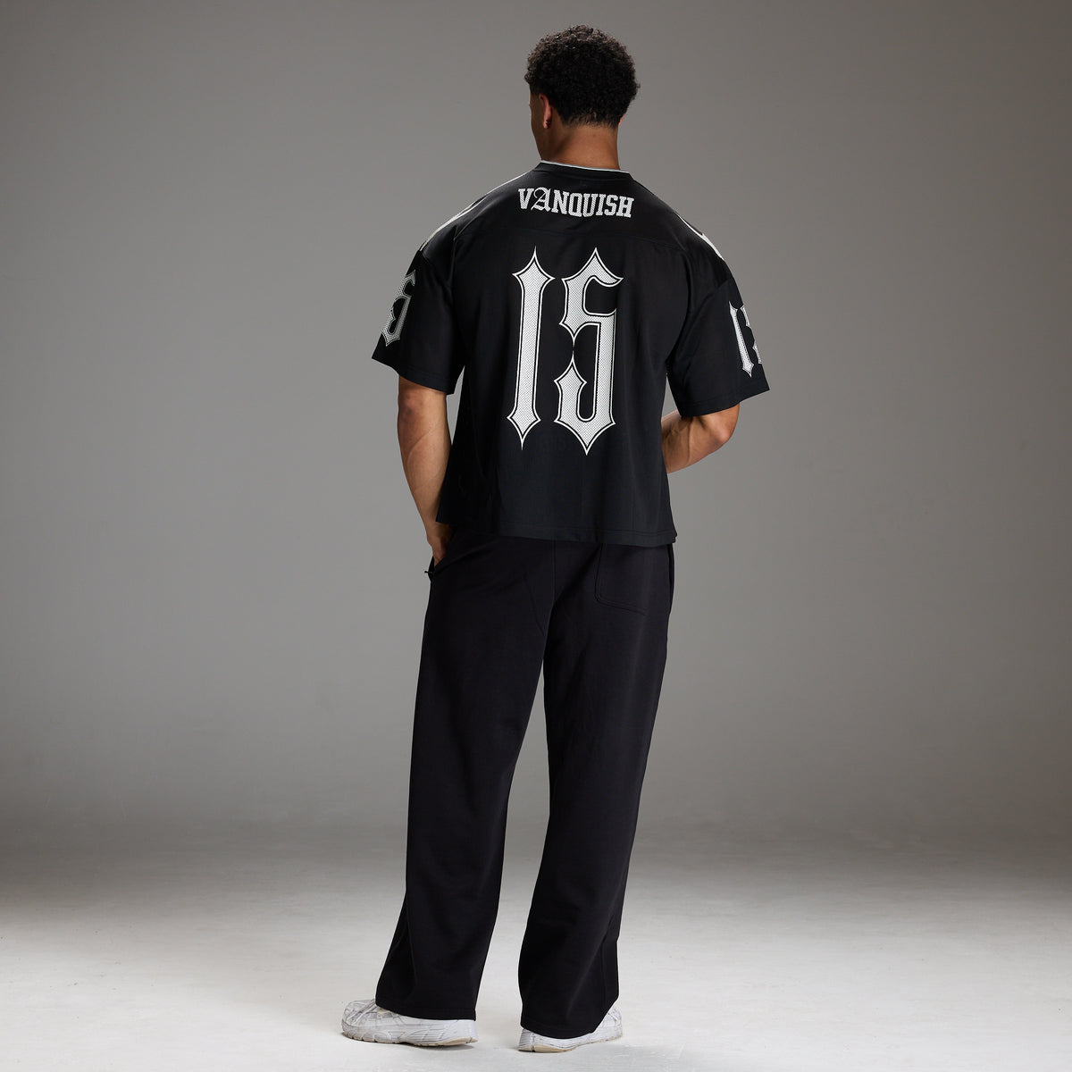 VARSITY TRIBAL BLACK OVERSIZED FOOTBALL T SHIRT