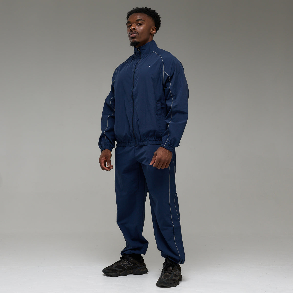 REFLECTIVE NAVY OVERSIZED TRACK PANTS
