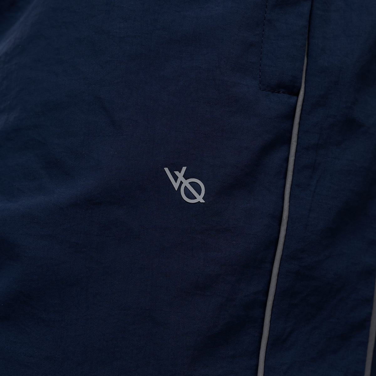 REFLECTIVE NAVY OVERSIZED TRACK PANTS
